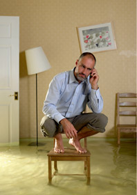 man in flooding house